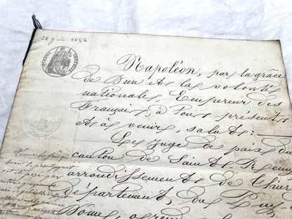 Mid 19th Century French notarial act, 1858, with elegant script and Imperial stamp featuring Justice figure.