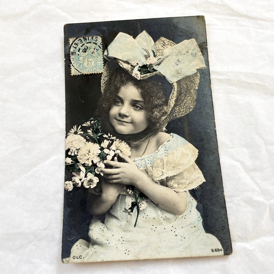 1900s - Vintage French Child Portrait Postcard - Belle Epoque Little Girl Holding Flowers - Hand-Colored Sepia Tone - Antique Collectible