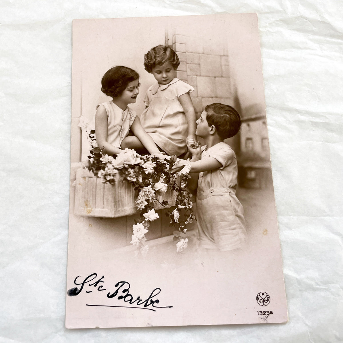 1920s - Charming Vintage Postcard - Three Children with Flowers - Sentimental Ephemera - Ste Barbe Dedication - Collectible Historical Piece