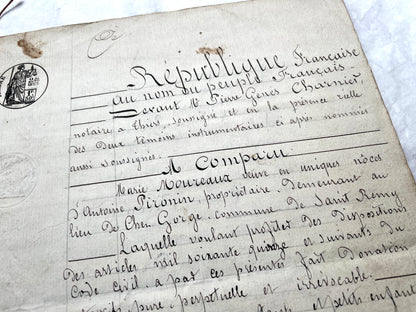 Late 19th Century French Notarial Act - Handwritten legal document with official stamps and elaborate script.