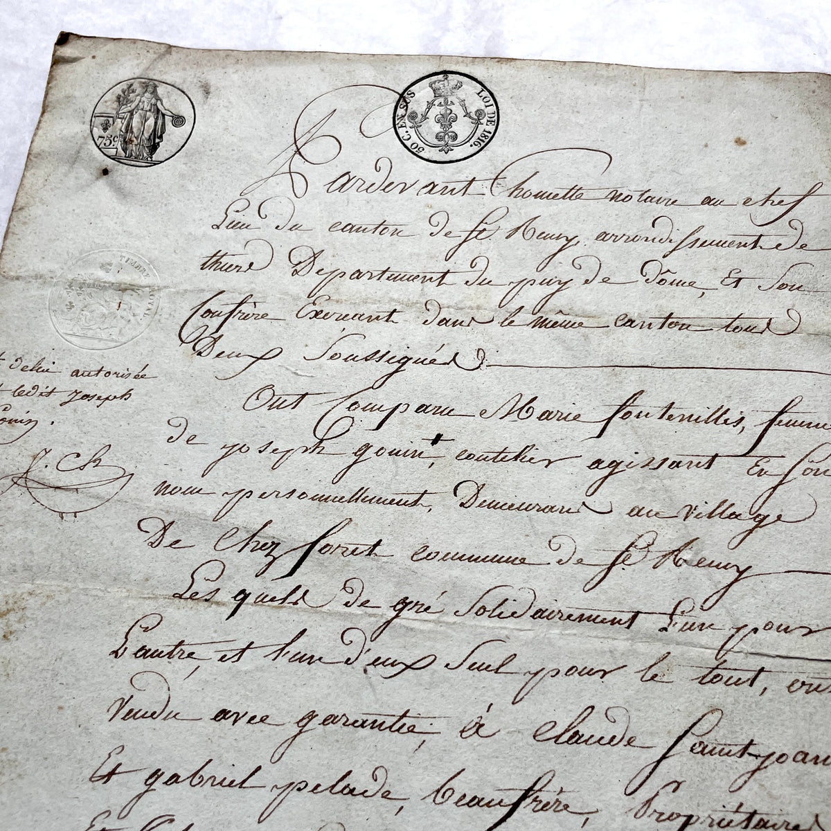 1810s French notarial act - detailed handwritten legal document with official stamps and elegant French script.