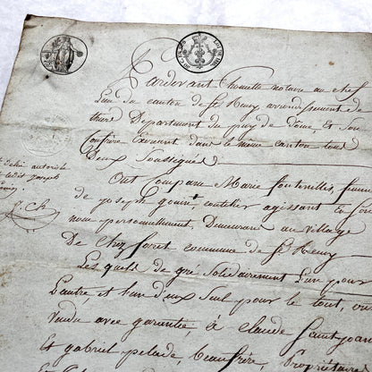 1810s French notarial act - detailed handwritten legal document with official stamps and elegant French script.