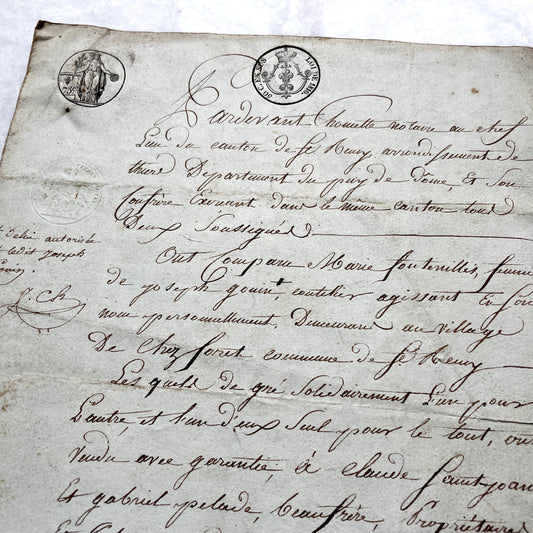 1810s French notarial act - detailed handwritten legal document with official stamps and elegant French script.