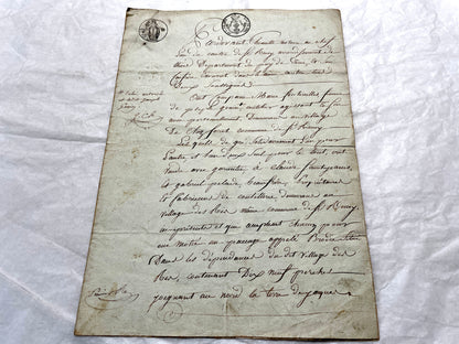 1810s French notarial act - detailed handwritten legal document with official stamps and elegant French script.