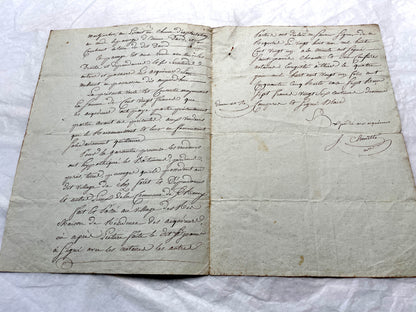 1810s French notarial act - detailed handwritten legal document with official stamps and elegant French script.