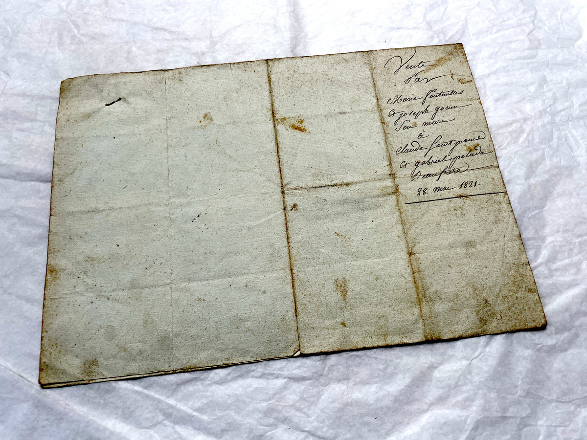 1810s French notarial act - detailed handwritten legal document with official stamps and elegant French script.