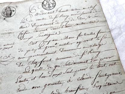 1810s French notarial act - detailed handwritten legal document with official stamps and elegant French script.
