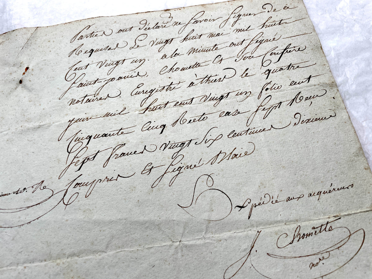 1810s French notarial act - detailed handwritten legal document with official stamps and elegant French script.