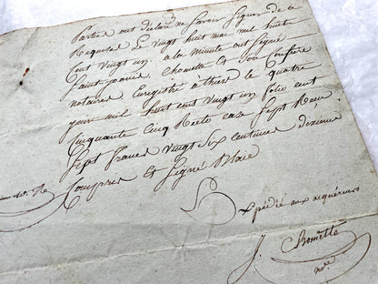 1810s French notarial act - detailed handwritten legal document with official stamps and elegant French script.
