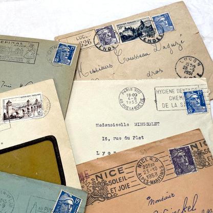 Lot of 20 French envelopes from the 1950s, featuring various postmarks, stamps, and handwritten addresses.