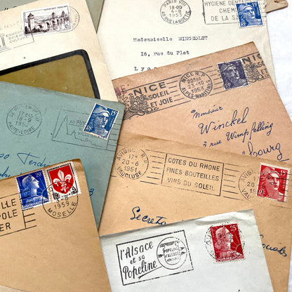 Lot of 20 French envelopes from the 1950s, featuring various postmarks, stamps, and handwritten addresses.