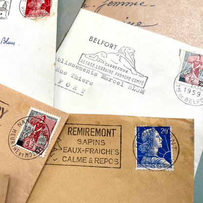 Lot of 20 French envelopes from the 1950s, featuring various postmarks, stamps, and handwritten addresses.