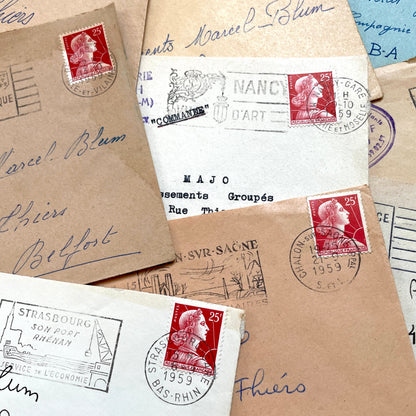 Lot of 20 French envelopes from the 1950s, featuring various postmarks, stamps, and handwritten addresses.