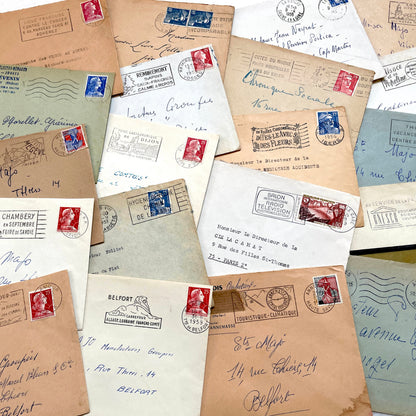 Lot of 20 French envelopes from the 1950s featuring various vintage stamps, postmarks, and handwritten addresses.