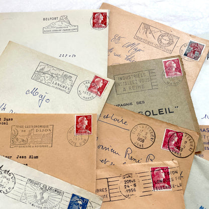Batch of 20 French envelopes from the 1950s featuring various vintage stamps, postmarks, and handwritten addresses.