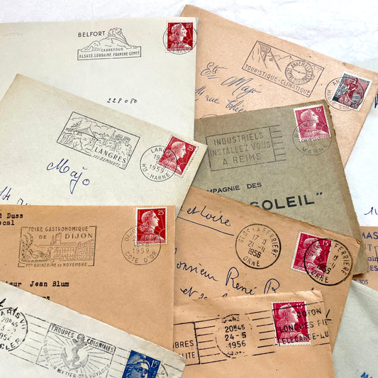 Batch of 20 French envelopes from the 1950s featuring various vintage stamps, postmarks, and handwritten addresses.