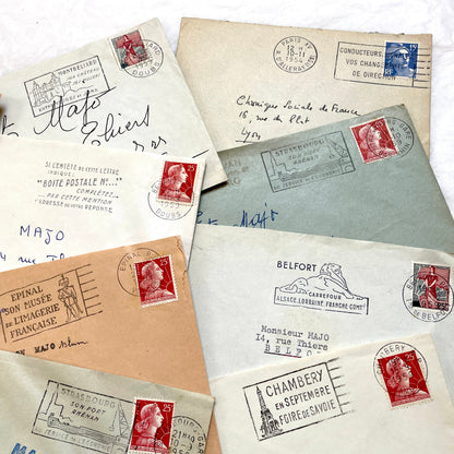 Batch of 20 French envelopes from the 1950s featuring various vintage stamps, postmarks, and handwritten addresses.