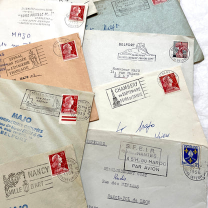 Batch of 20 French envelopes from the 1950s featuring various vintage stamps, postmarks, and handwritten addresses.
