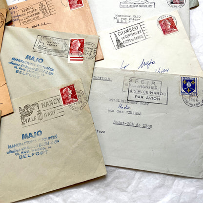 Batch of 20 French envelopes from the 1950s featuring various vintage stamps, postmarks, and handwritten addresses.