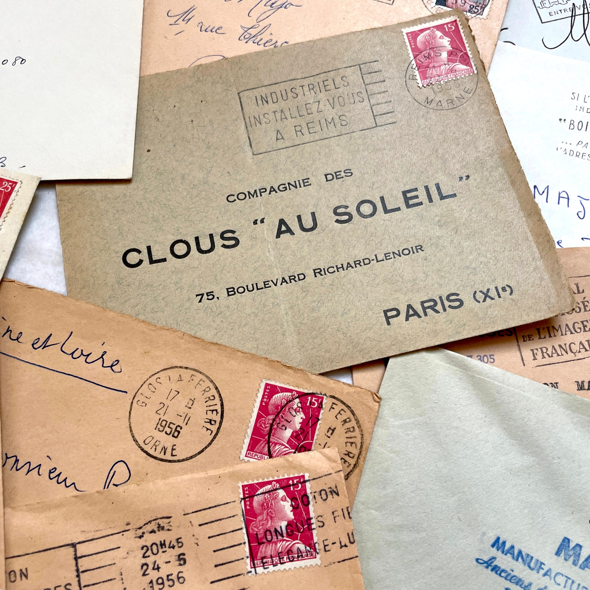 Batch of 20 French envelopes from the 1950s featuring various vintage stamps, postmarks, and handwritten addresses.