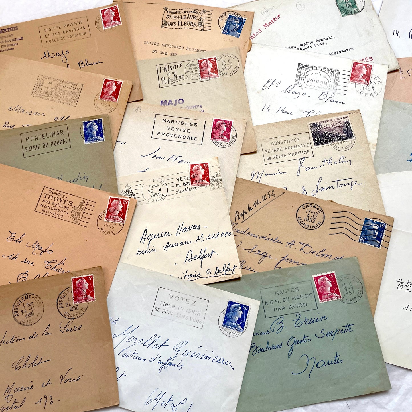 Lot of 20 1950s French envelopes with vintage stamps and detailed postmarks, showing historical European mail.
