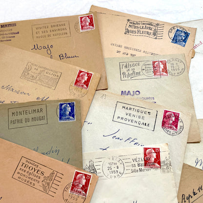 Lot of 20 1950s French envelopes with vintage stamps and detailed postmarks, showing historical European mail.