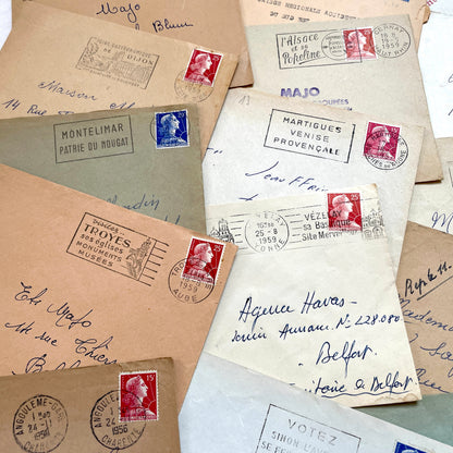Lot of 20 1950s French envelopes with vintage stamps and detailed postmarks, showing historical European mail.