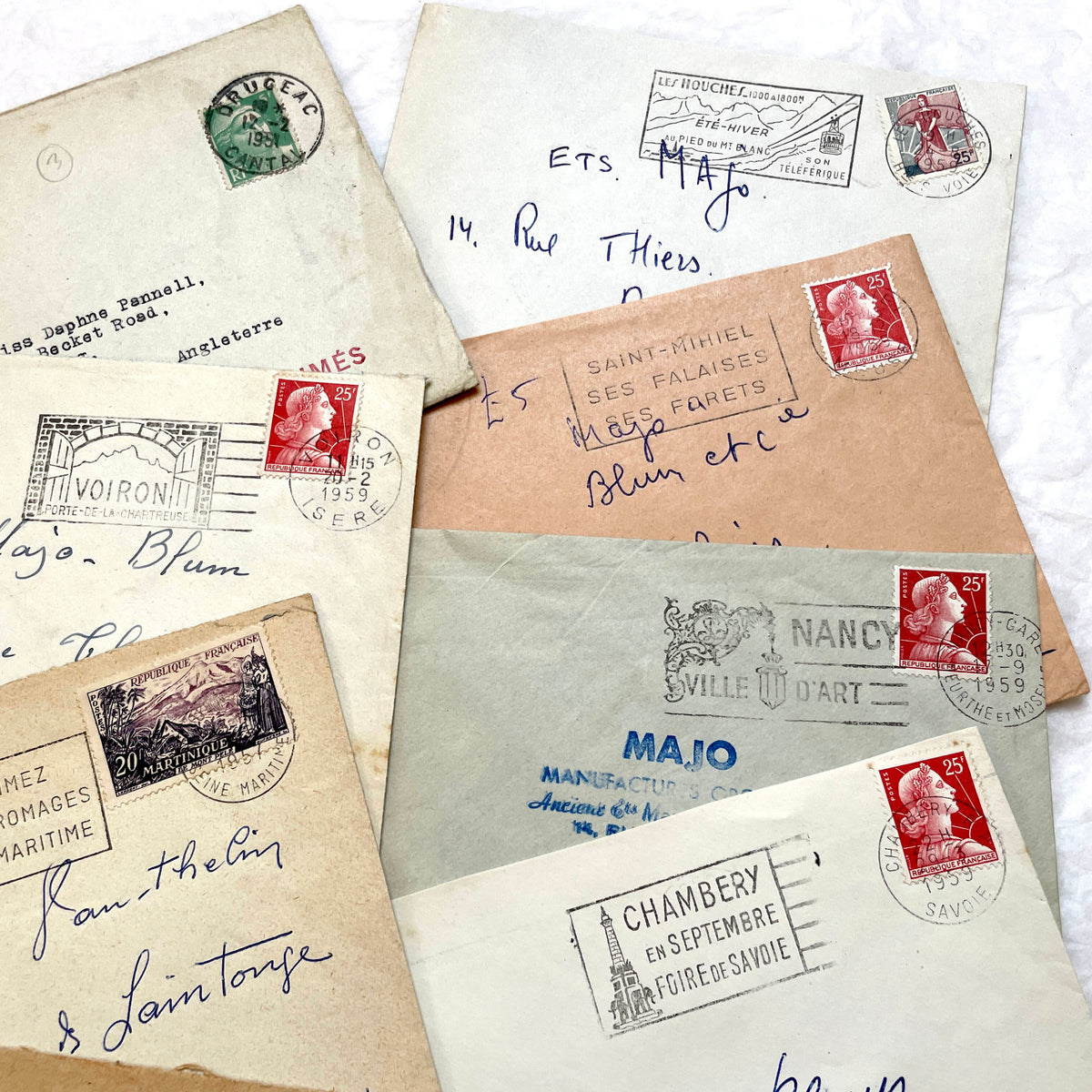 Lot of 20 1950s French envelopes with vintage stamps and detailed postmarks, showing historical European mail.