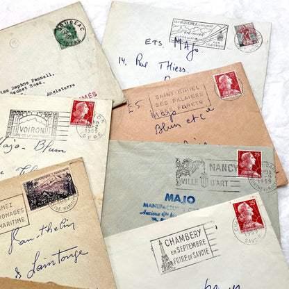 Lot of 20 1950s French envelopes with vintage stamps and detailed postmarks, showing historical European mail.