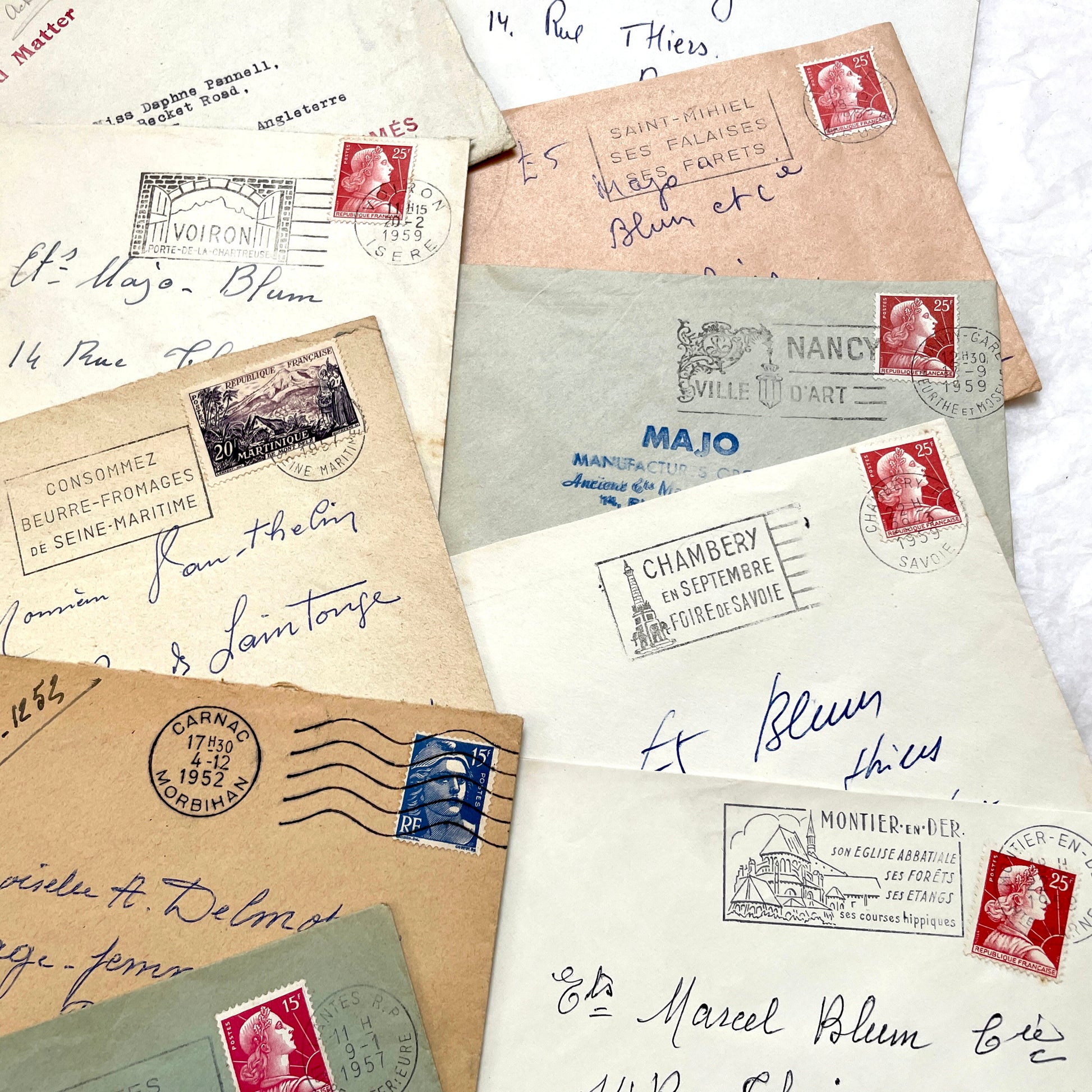 Lot of 20 1950s French envelopes with vintage stamps and detailed postmarks, showing historical European mail.