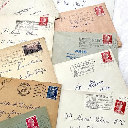 Lot of 20 1950s French envelopes with vintage stamps and detailed postmarks, showing historical European mail.