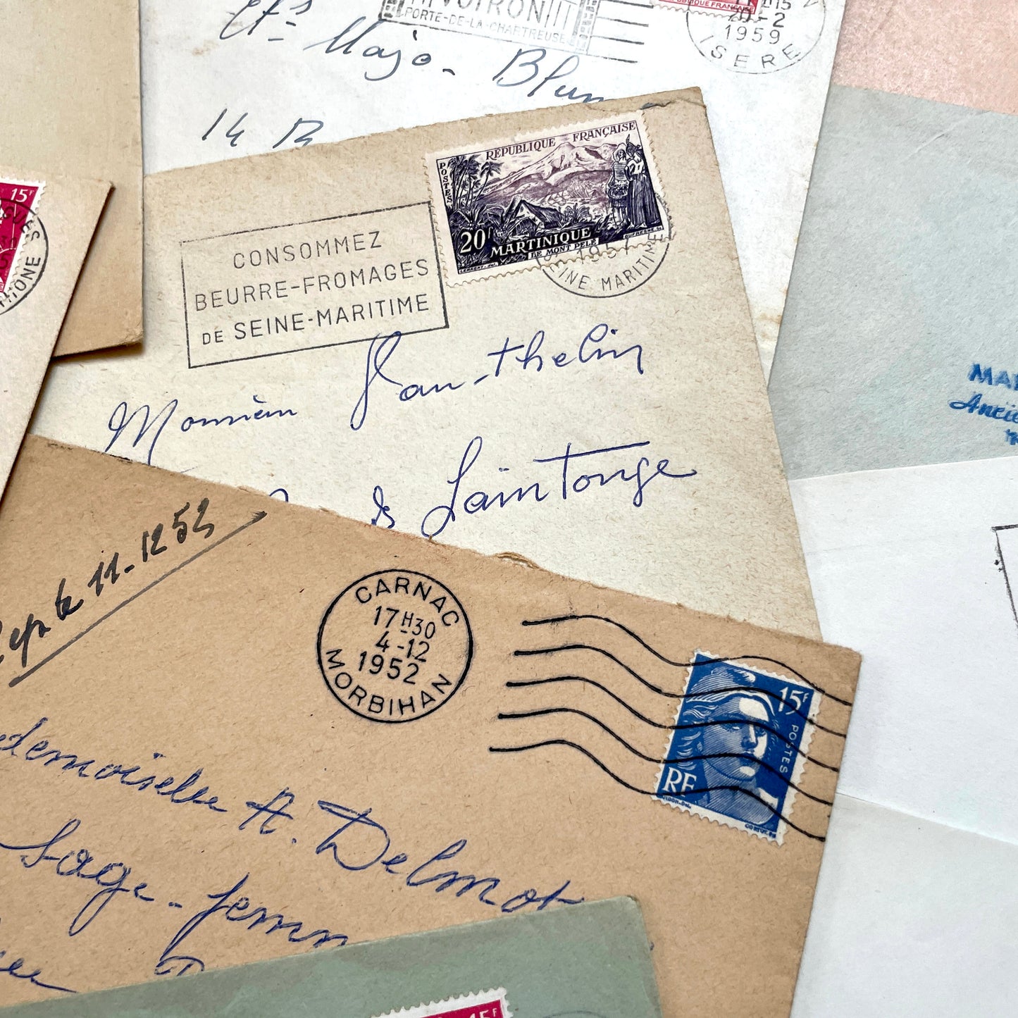 Lot of 20 1950s French envelopes with vintage stamps and detailed postmarks, showing historical European mail.