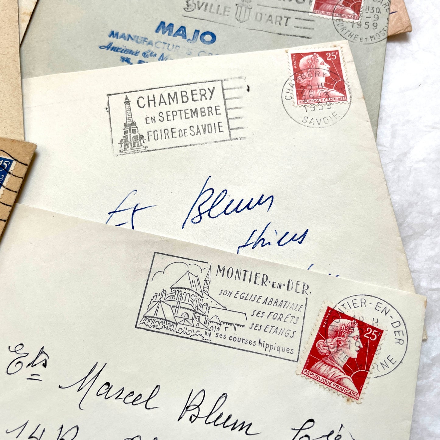 Lot of 20 1950s French envelopes with vintage stamps and detailed postmarks, showing historical European mail.