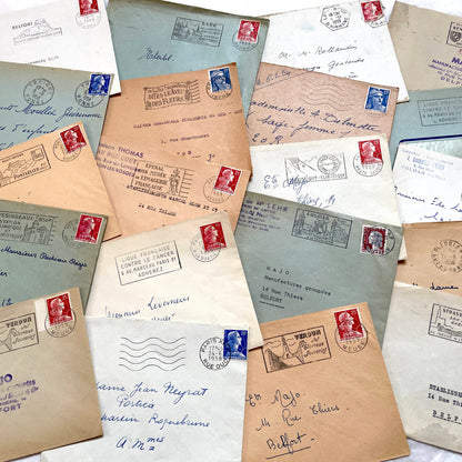 Lot of 20 French envelopes from the 1950s with various postmarks and postage stamps.