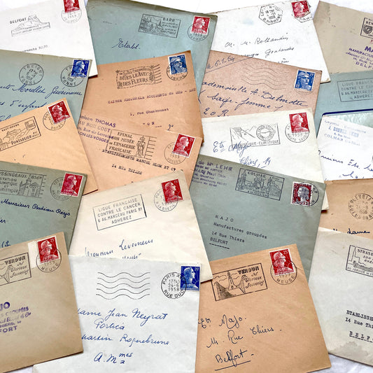 Lot of 20 French envelopes from the 1950s with various postmarks and postage stamps.