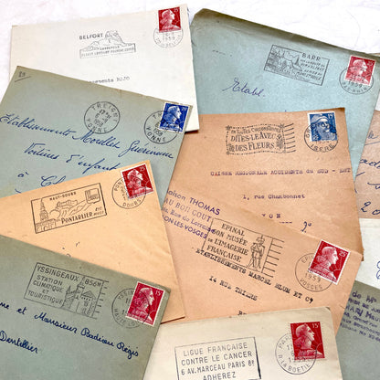 Lot of 20 French envelopes from the 1950s with various postmarks and postage stamps.
