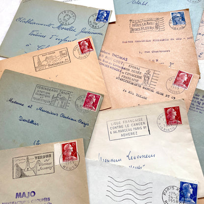 Lot of 20 French envelopes from the 1950s with various postmarks and postage stamps.