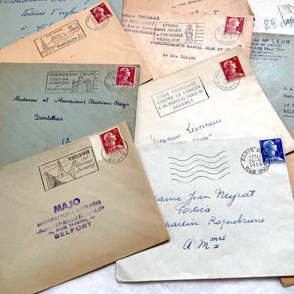 Lot of 20 French envelopes from the 1950s with various postmarks and postage stamps.