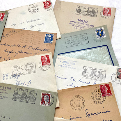 Lot of 20 French envelopes from the 1950s with various postmarks and postage stamps.