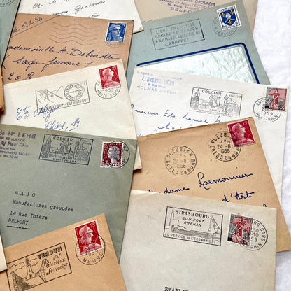 Lot of 20 French envelopes from the 1950s with various postmarks and postage stamps.