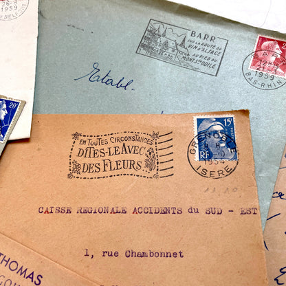 Lot of 20 French envelopes from the 1950s with various postmarks and postage stamps.