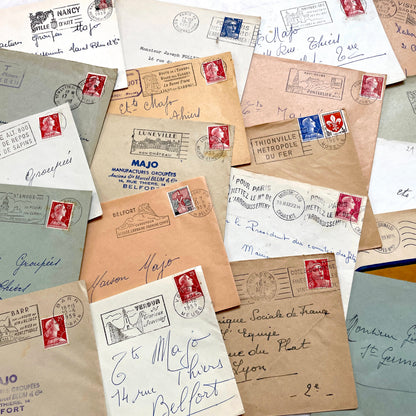 Lot of 20 vintage French envelopes from the 1950s, featuring various postmarks and stamps, ideal for collectors.
