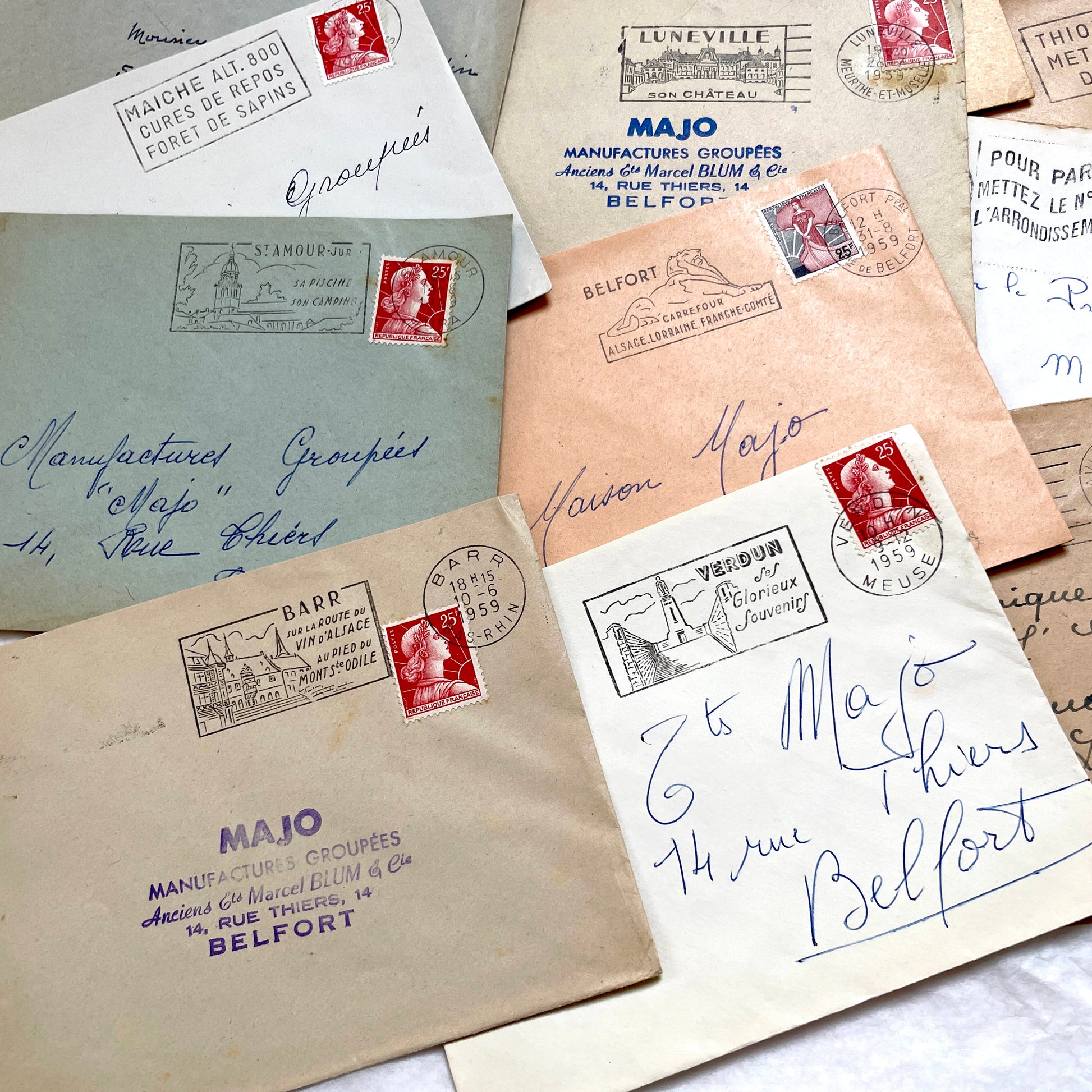 Lot of 20 vintage French envelopes from the 1950s, featuring various postmarks and stamps, ideal for collectors.
