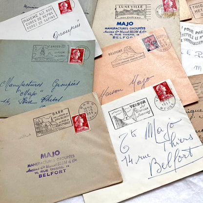 Lot of 20 vintage French envelopes from the 1950s, featuring various postmarks and stamps, ideal for collectors.