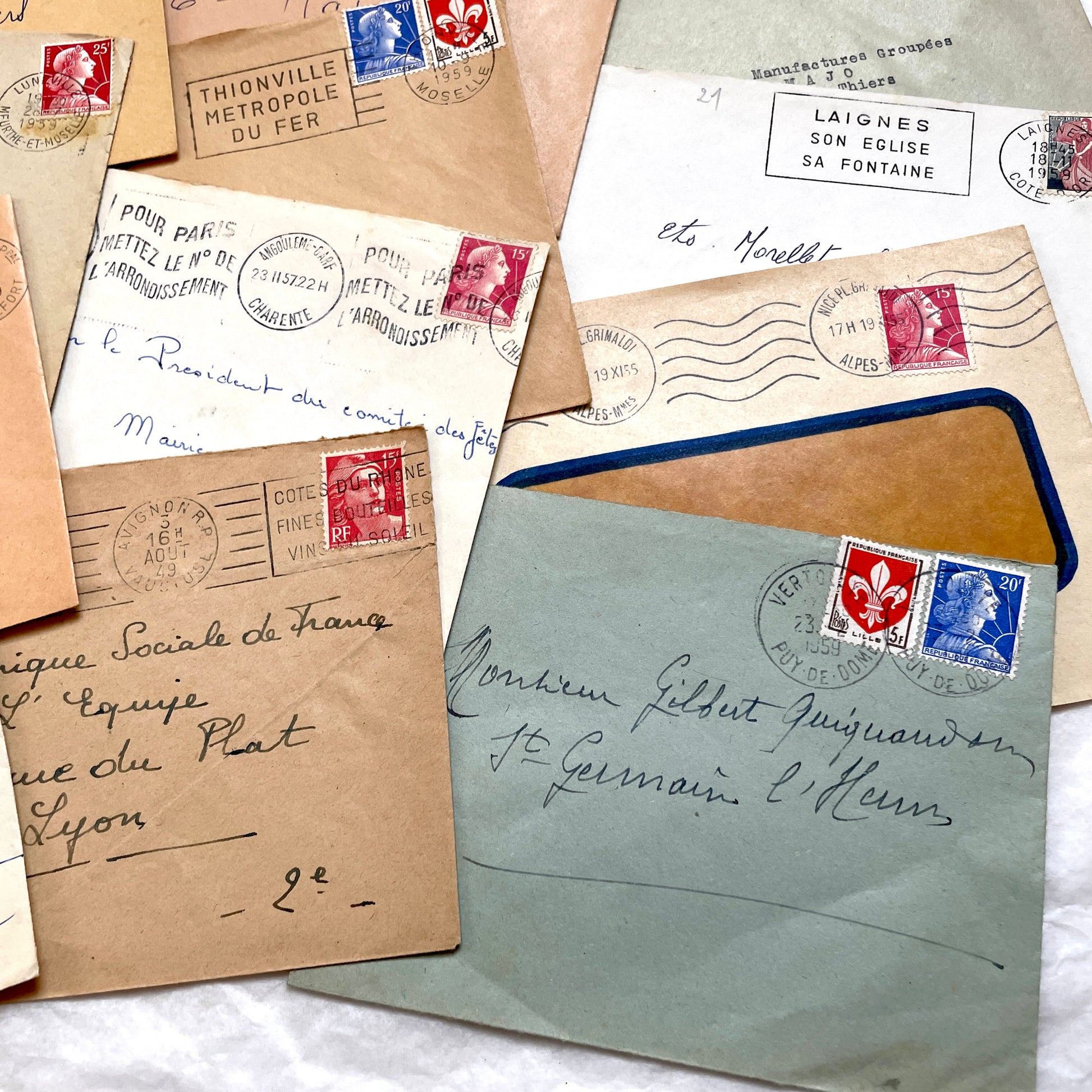 Lot of 20 vintage French envelopes from the 1950s, featuring various postmarks and stamps, ideal for collectors.