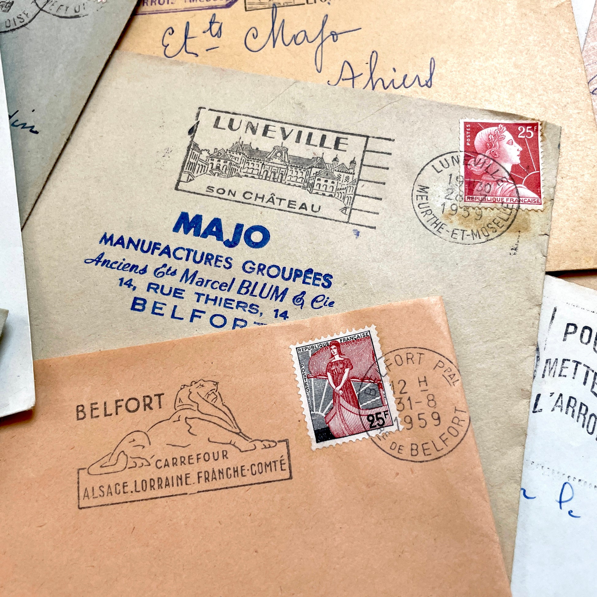 Lot of 20 vintage French envelopes from the 1950s, featuring various postmarks and stamps, ideal for collectors.