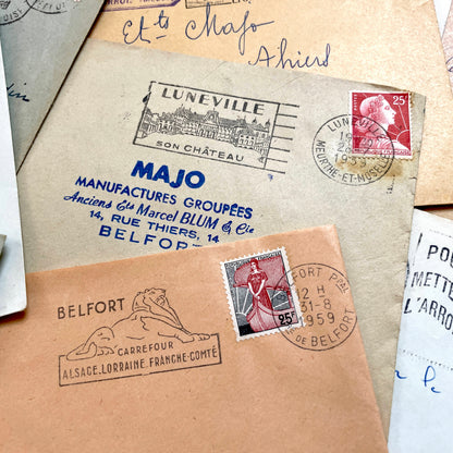 Lot of 20 vintage French envelopes from the 1950s, featuring various postmarks and stamps, ideal for collectors.