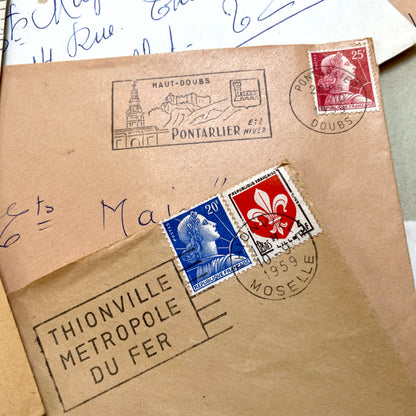 Lot of 20 vintage French envelopes from the 1950s, featuring various postmarks and stamps, ideal for collectors.
