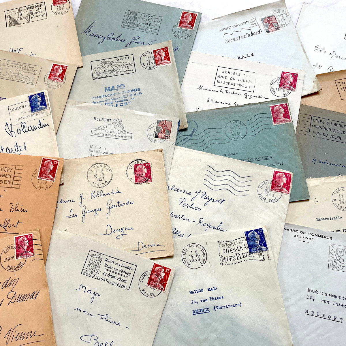Lot of 20 French envelopes from the 1950s, featuring various postal stamps, handwritten addresses, and distinct postmarks.