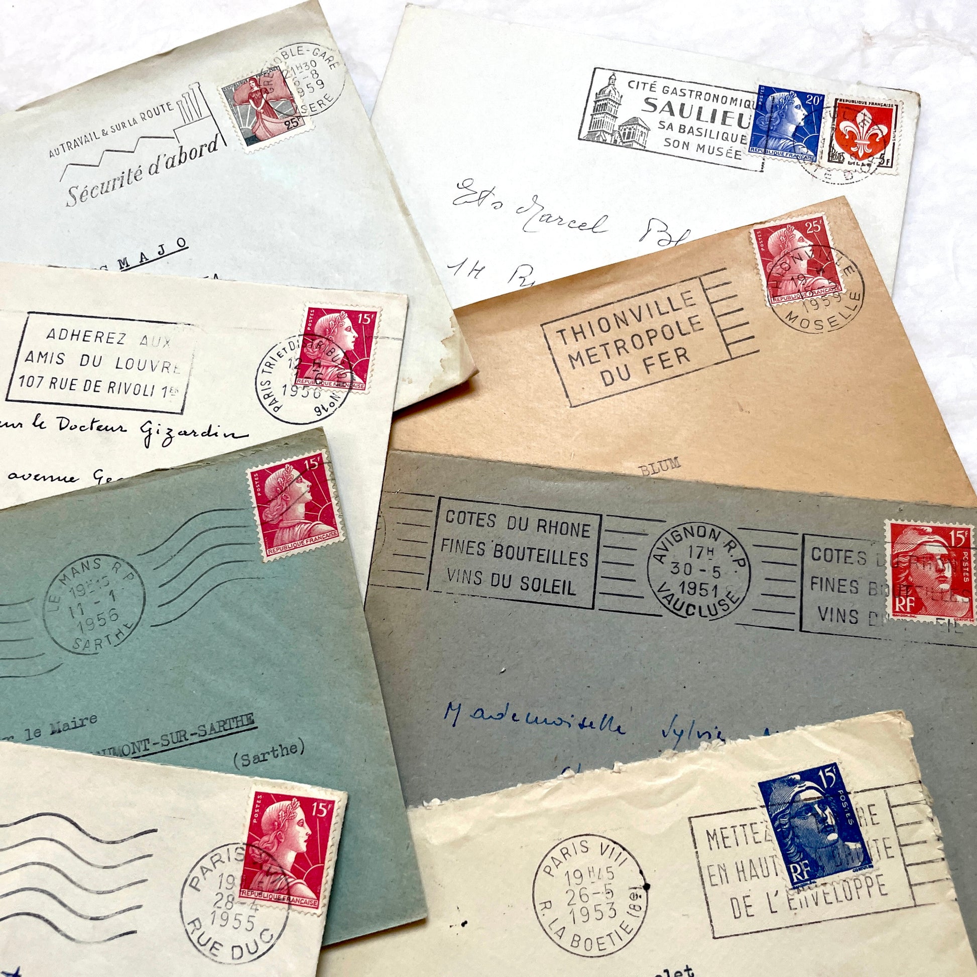 Lot of 20 French envelopes from the 1950s, featuring various postal stamps, handwritten addresses, and distinct postmarks.